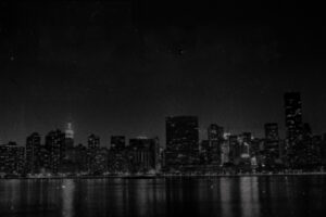 Dark and creepy NYC skyline over harber